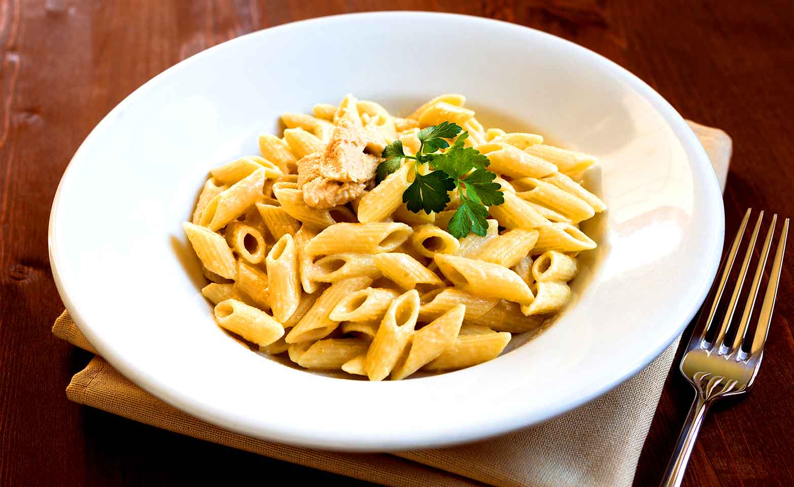 Stock image of chicken alfredo with penne
