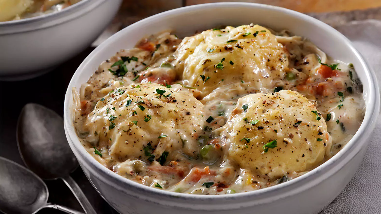 A bowl of chicken dumpling soup.