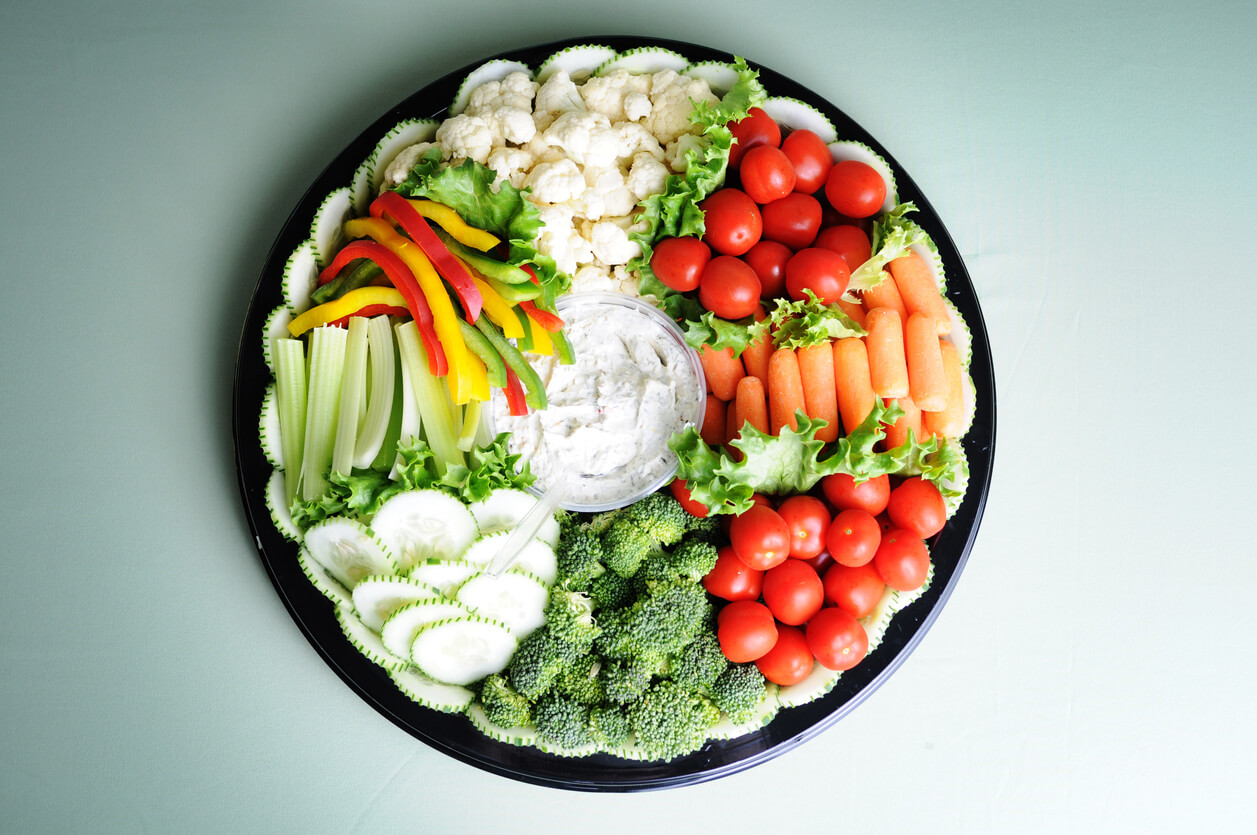 A delicious fresh vegetable tray with dip.