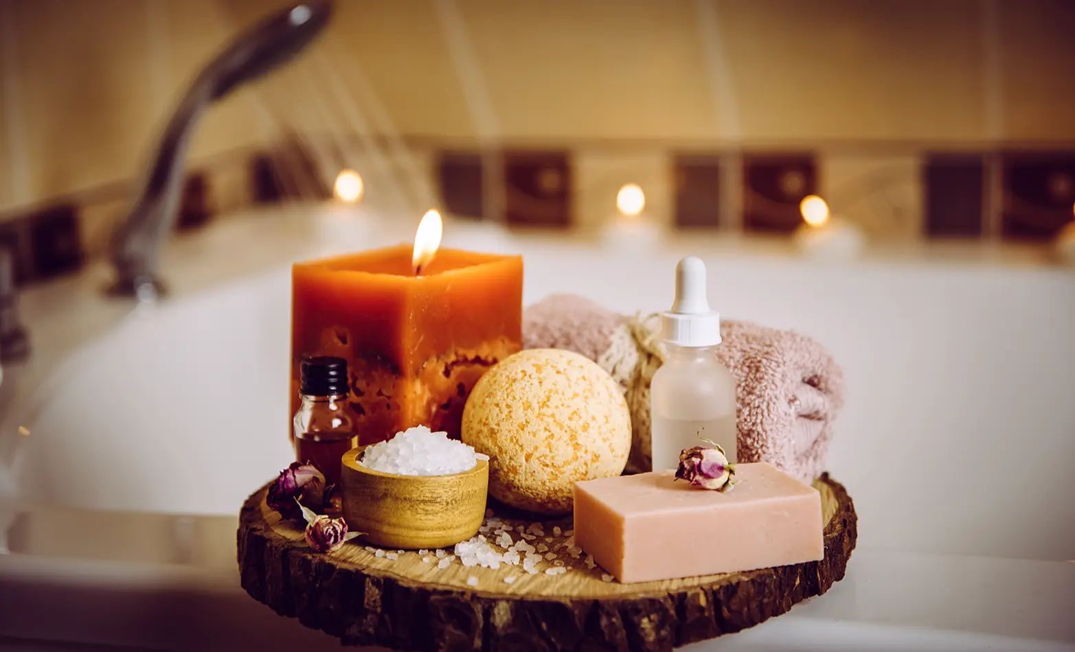 A photo of a bubble bath with candles.