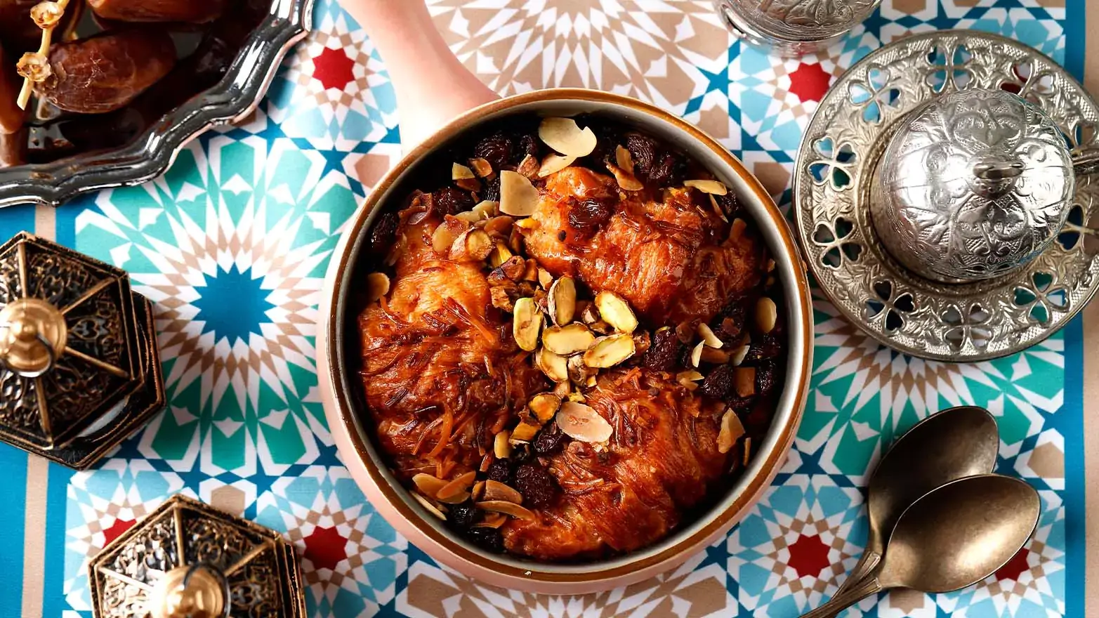 a dish of Egyptian bread pudding on a colorful tablecloth