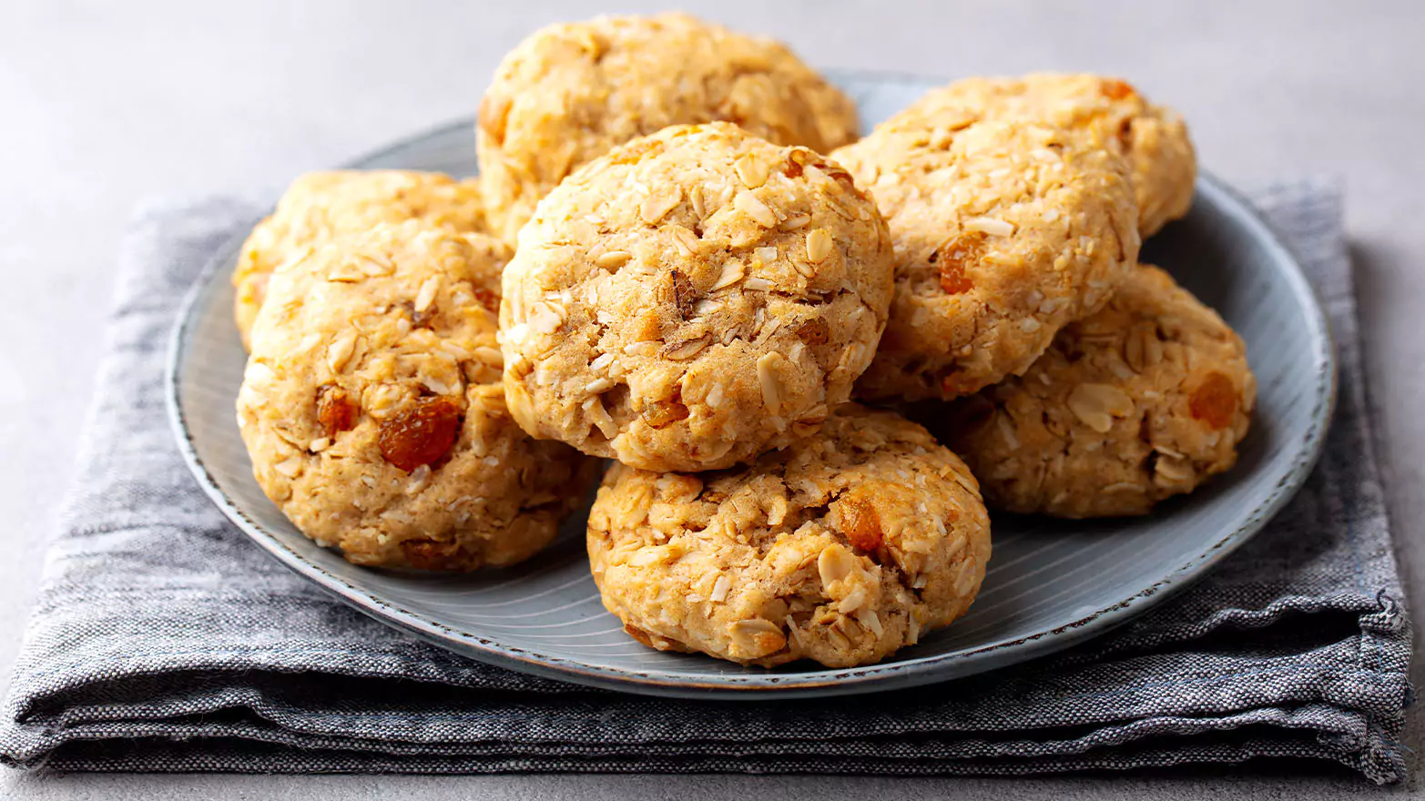 A pile of cinnamon apple cookies on a plate