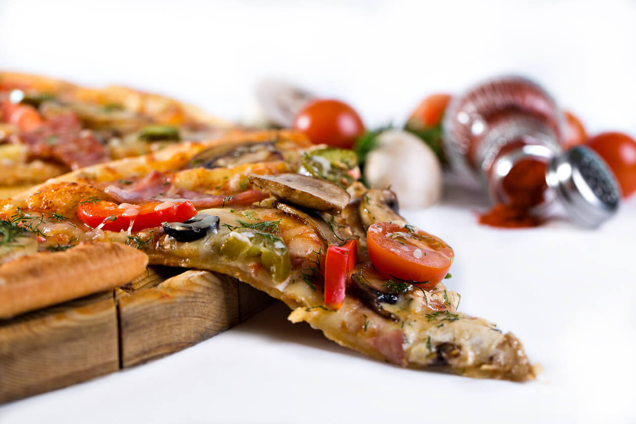 Delicious italian pizza served on wooden table.