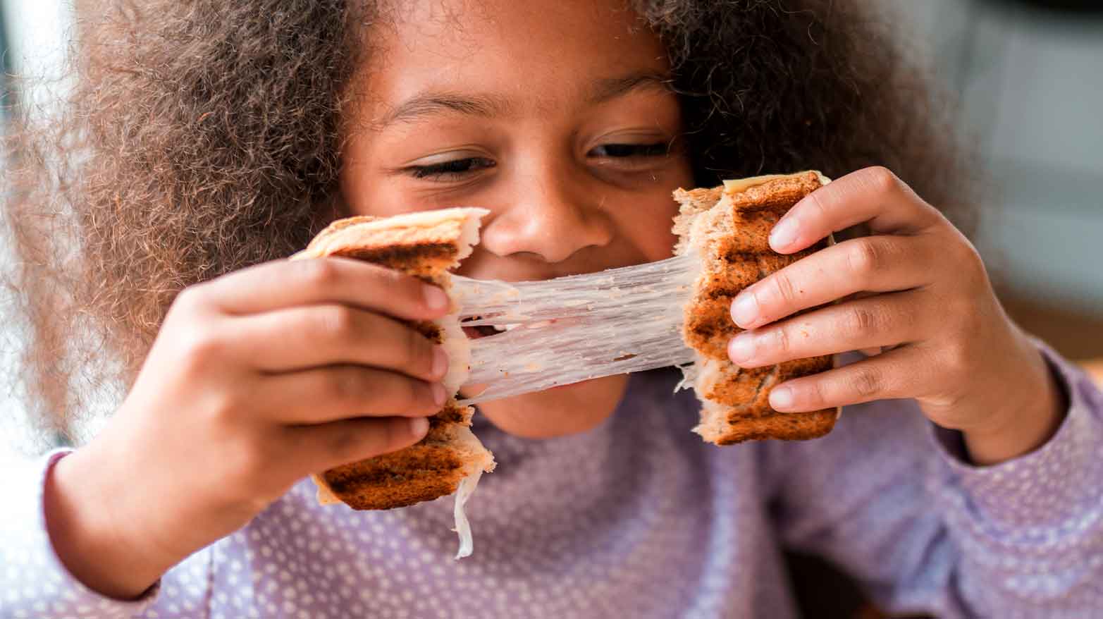 Cooking grilled cheese for kids.
