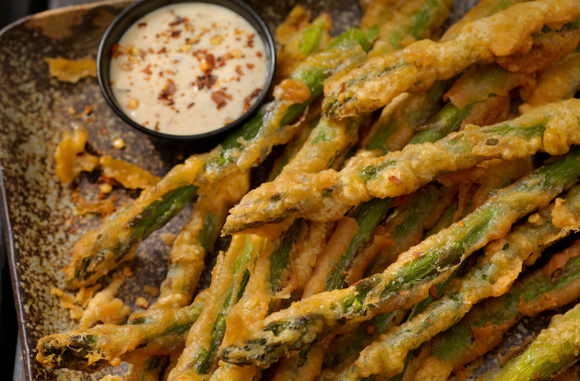 Beer Battered Asparagus on a pan.