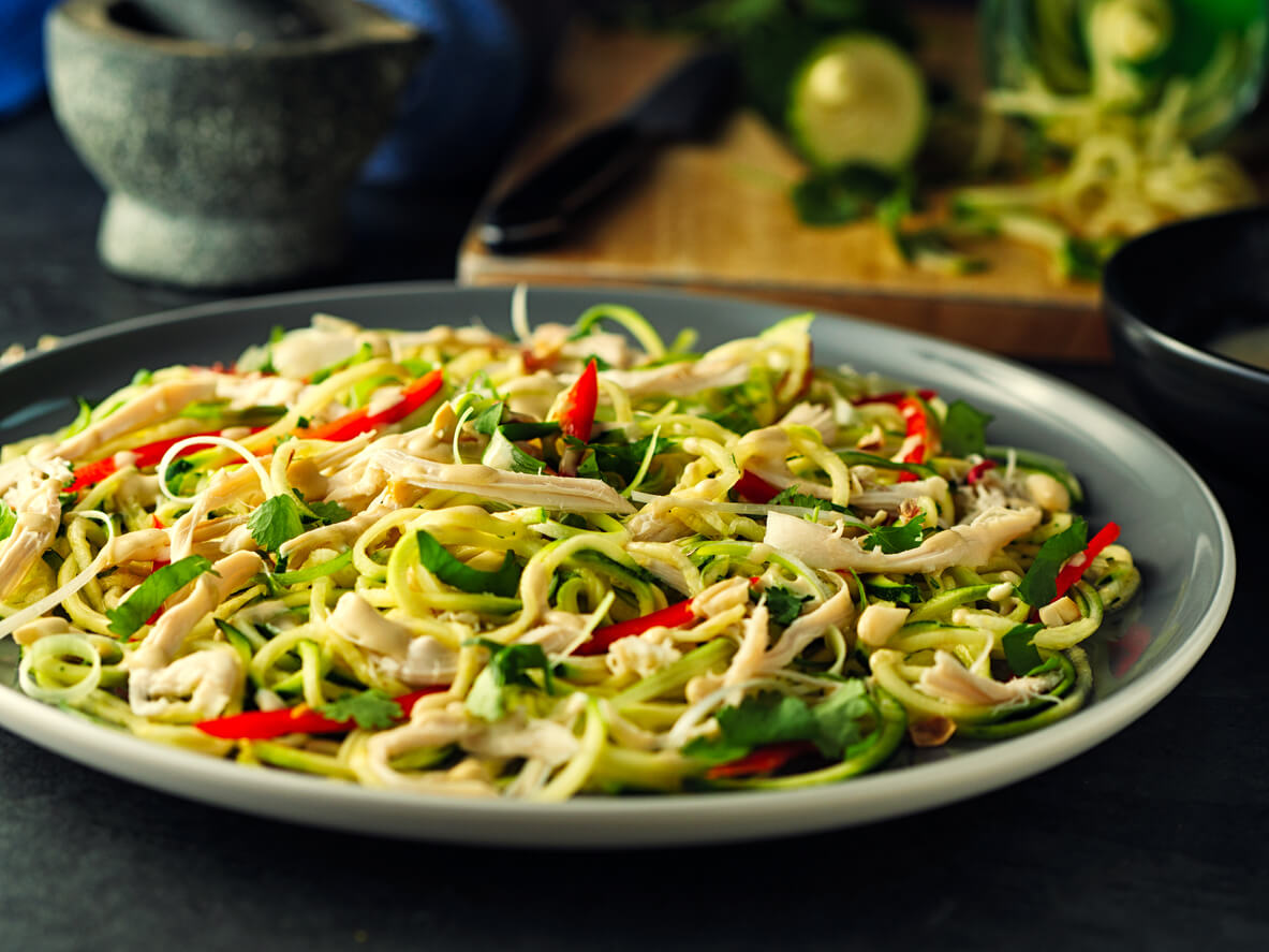 Home made freshness courgette noodles with bang bang chicken salad with tahini peanuts dressing.