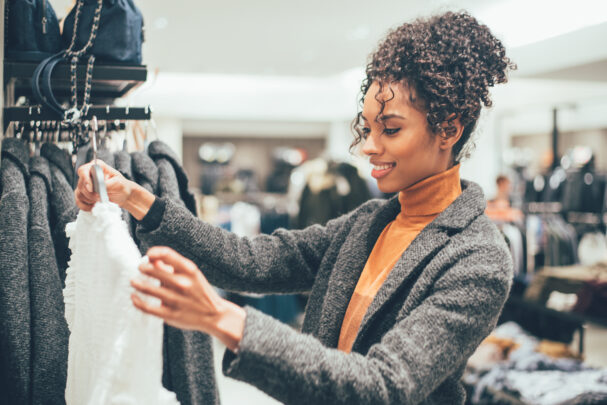 woman looking critically at clothes