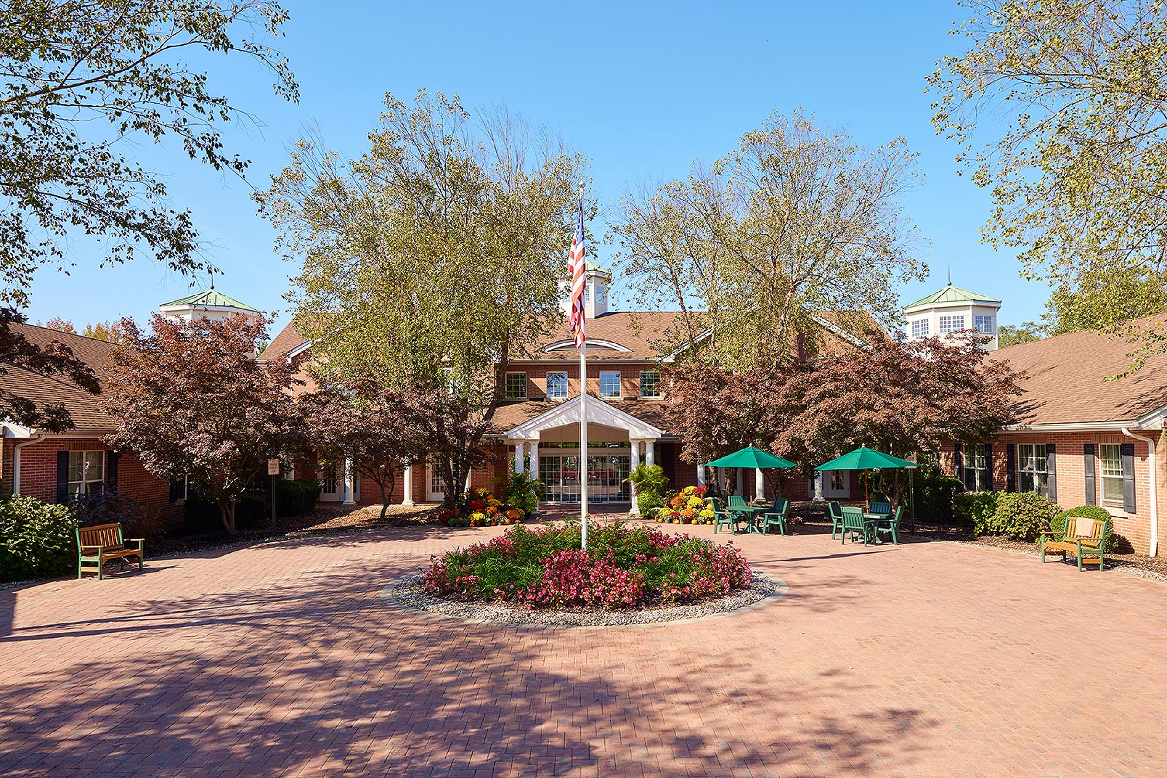 Brandywine Colts Neck The American flag, benches, chairs and umbrellas at the entrance