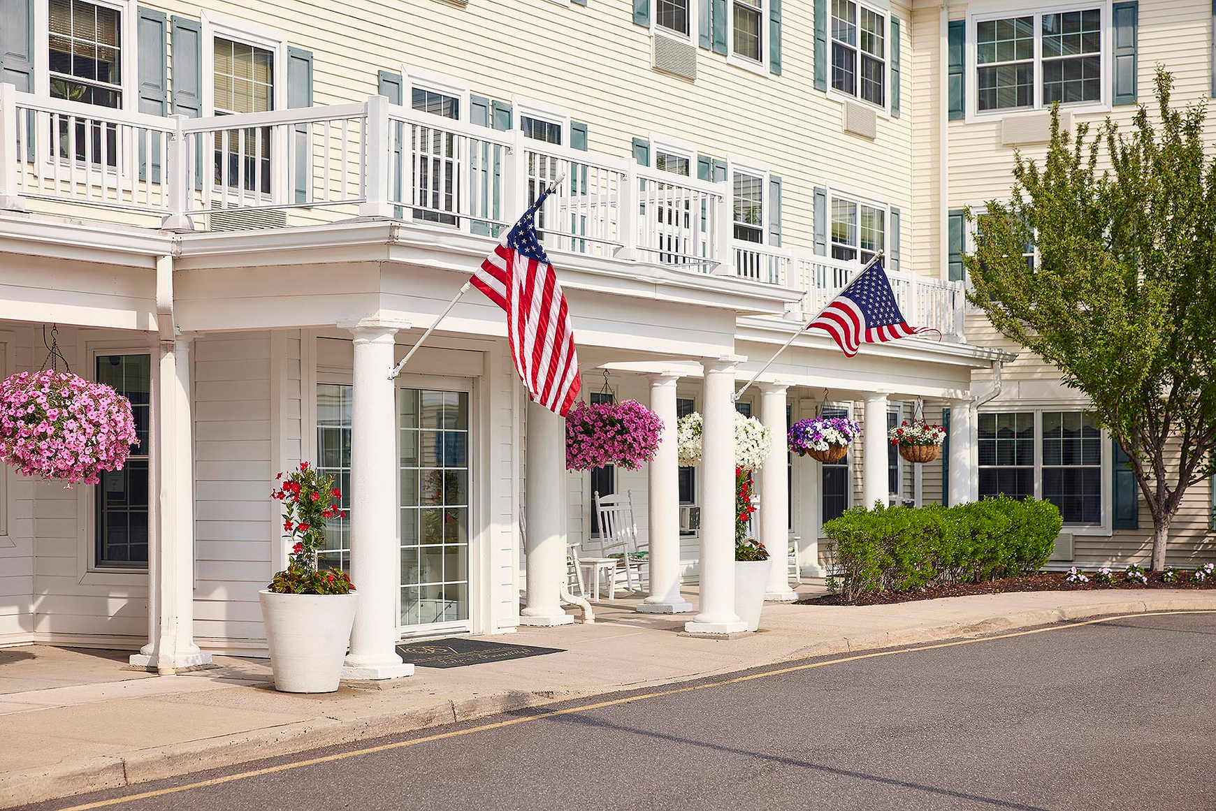 American flags and colorful flowers greet you at the entrance
