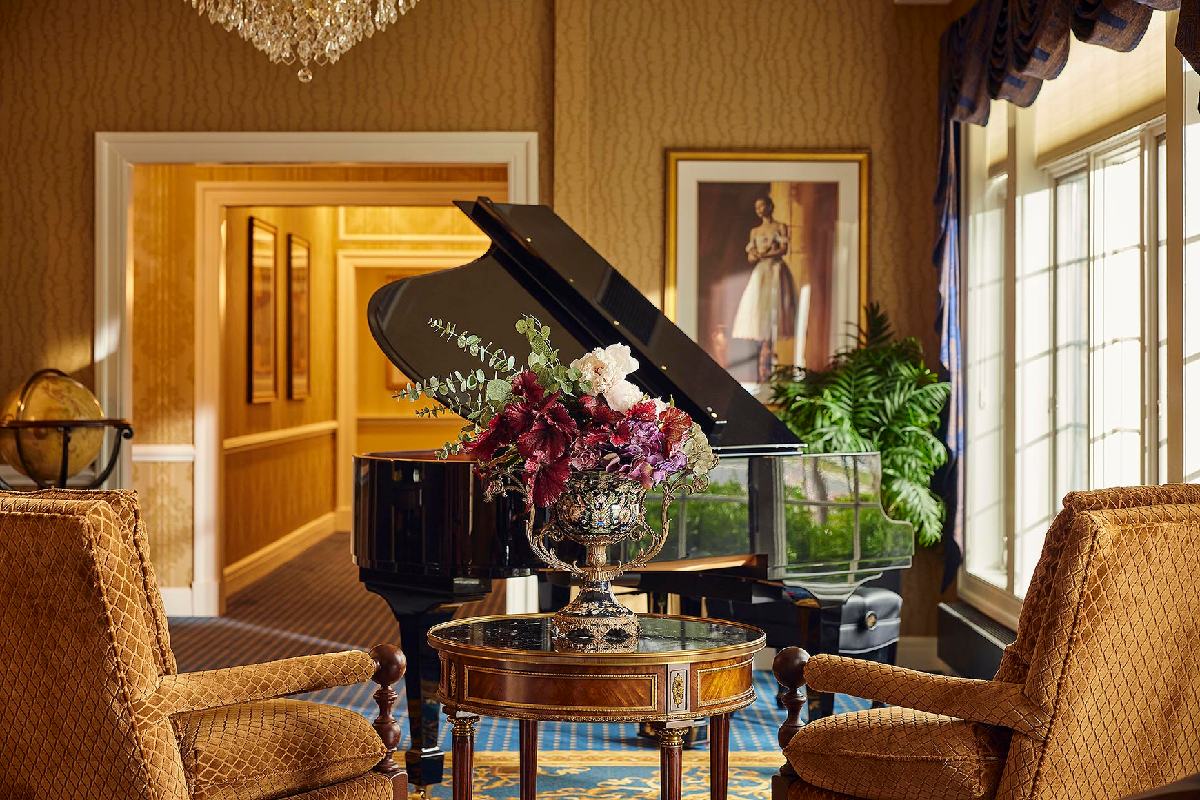 A baby grand piano in the grand lobby