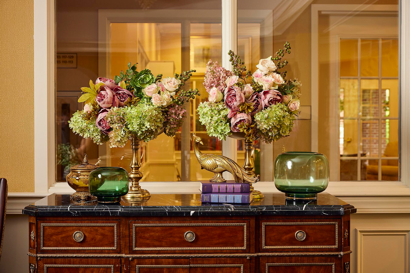 Elegant floral arrangments on a credenza