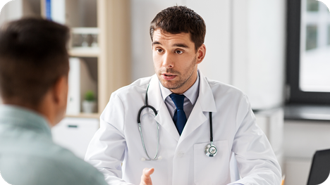 Doctor speaking to male patient