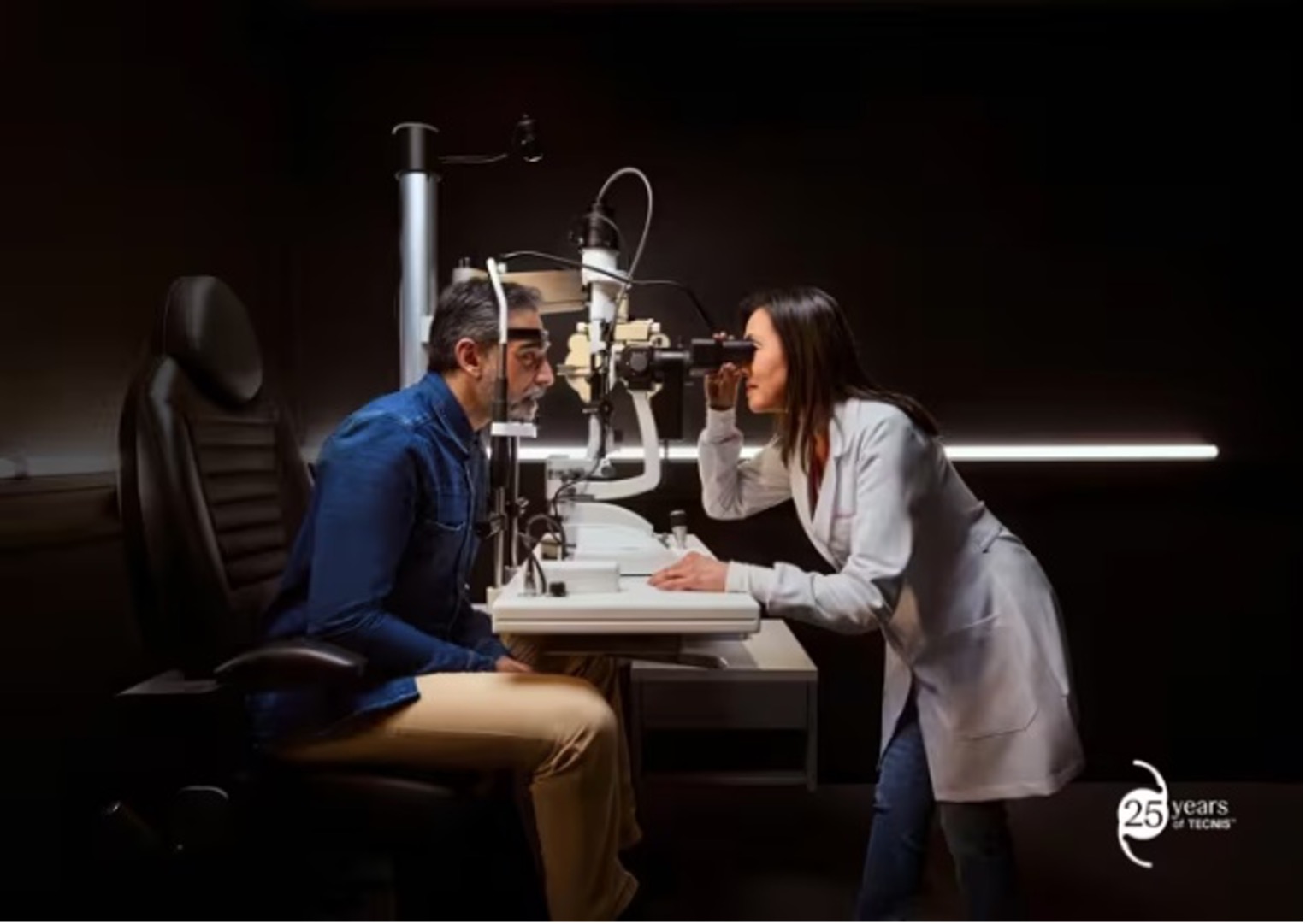 An optometrist gives a man a comprehensive eye exam An optometrist gives a man a comprehensive eye exam