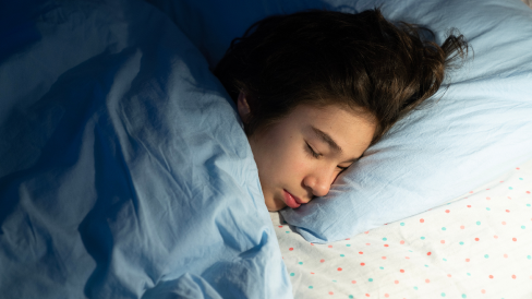 Girl asleep on her pillow