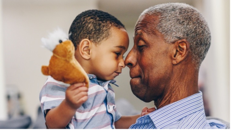 Grandparent holding grandchild