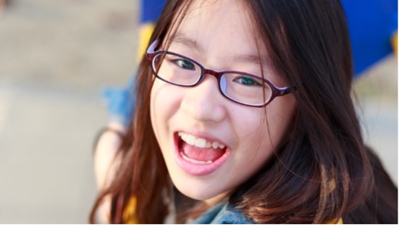 Little girl with eye glasses