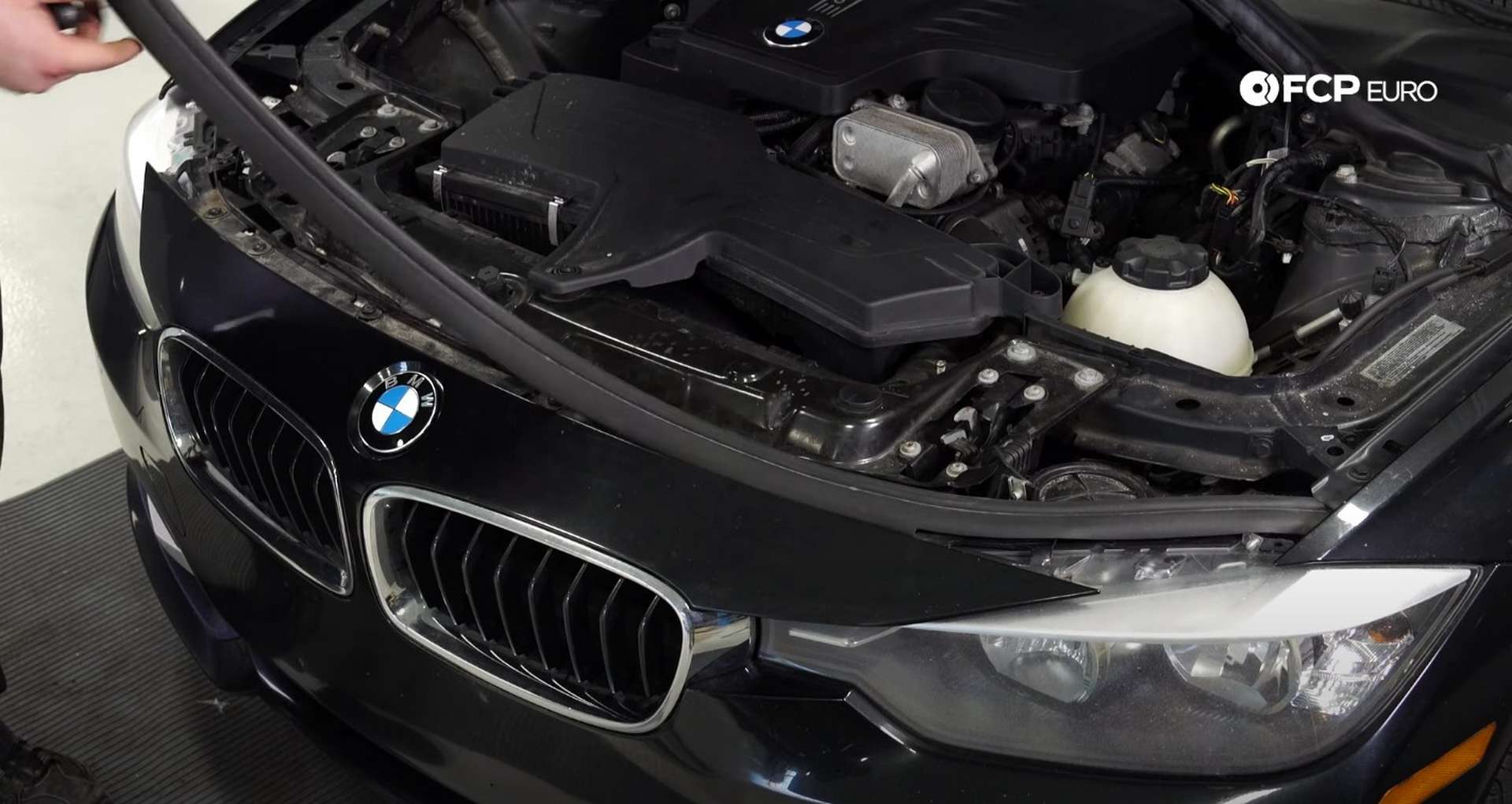 DIY BMW F30 Kidney Grill Replacement removing the hood seal from the top of the bumper