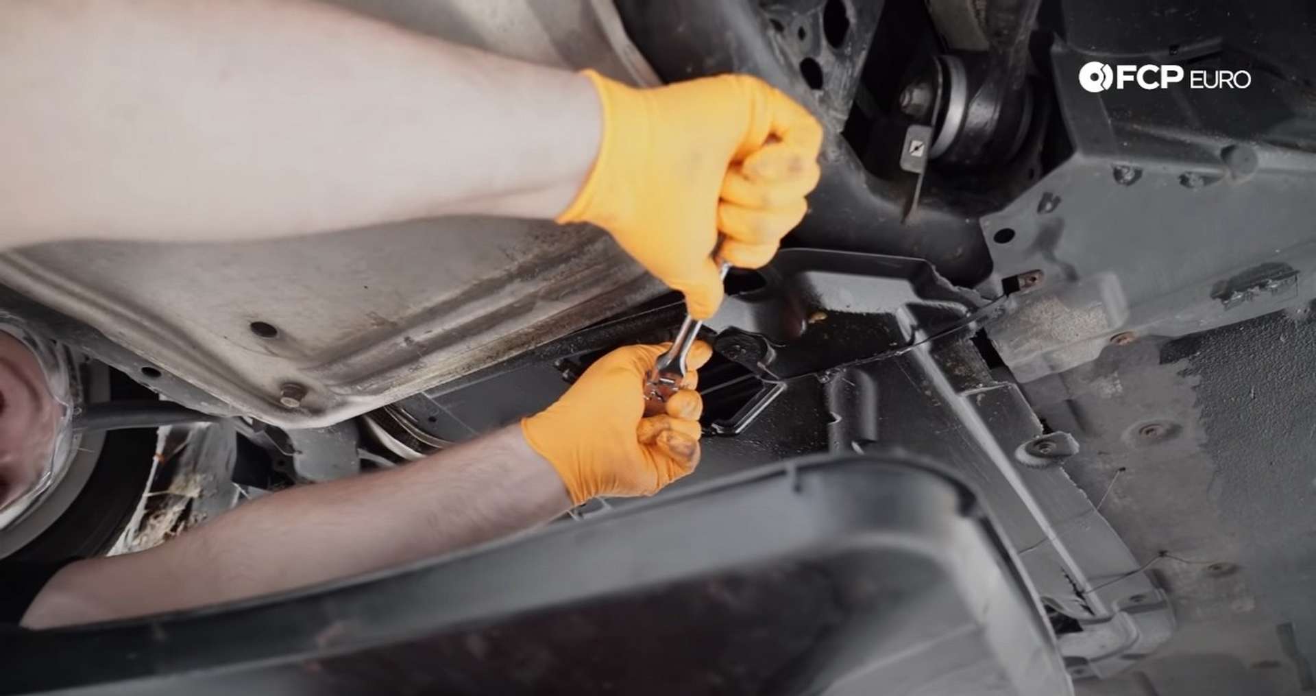 DIY BMW E9X Oil Filter Gasket Replacement removing the oil drain plug