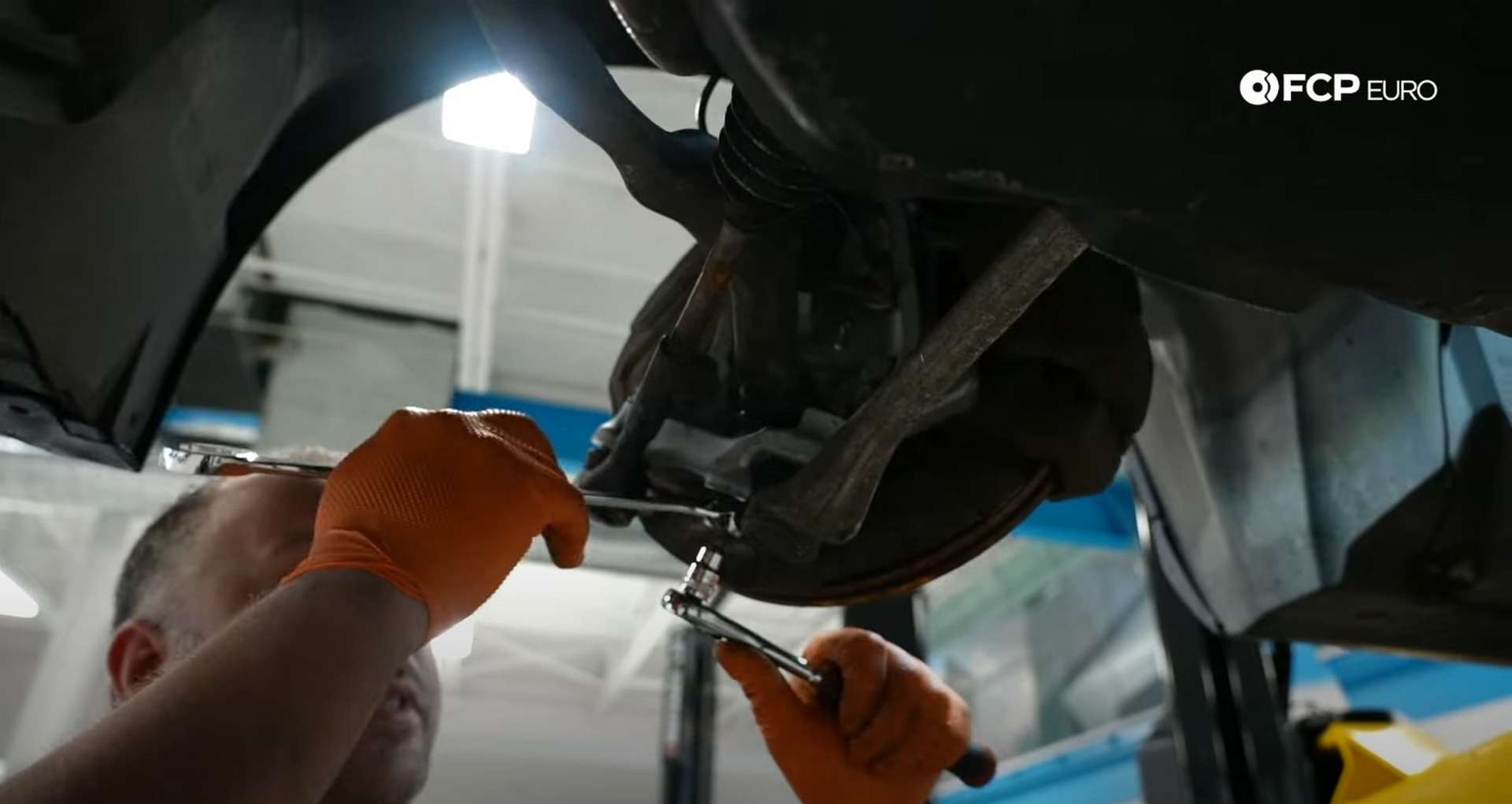 DIY BMW E9X Front Control Arm Upgrade removing the tension rod’s ball joint nut