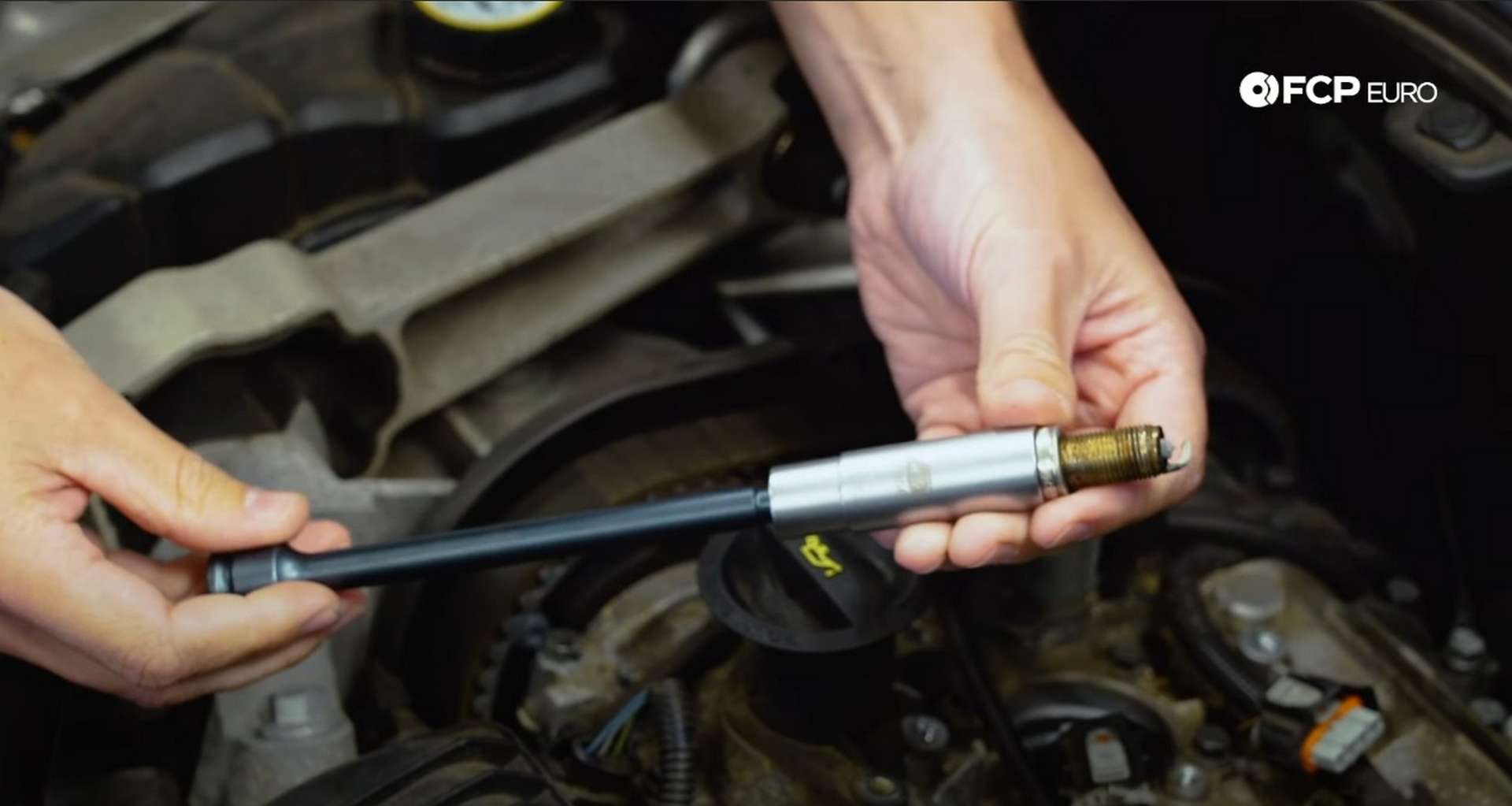 DIY Volvo Spark Plug and Ignition Coil Replacement spark plug removed in the socket