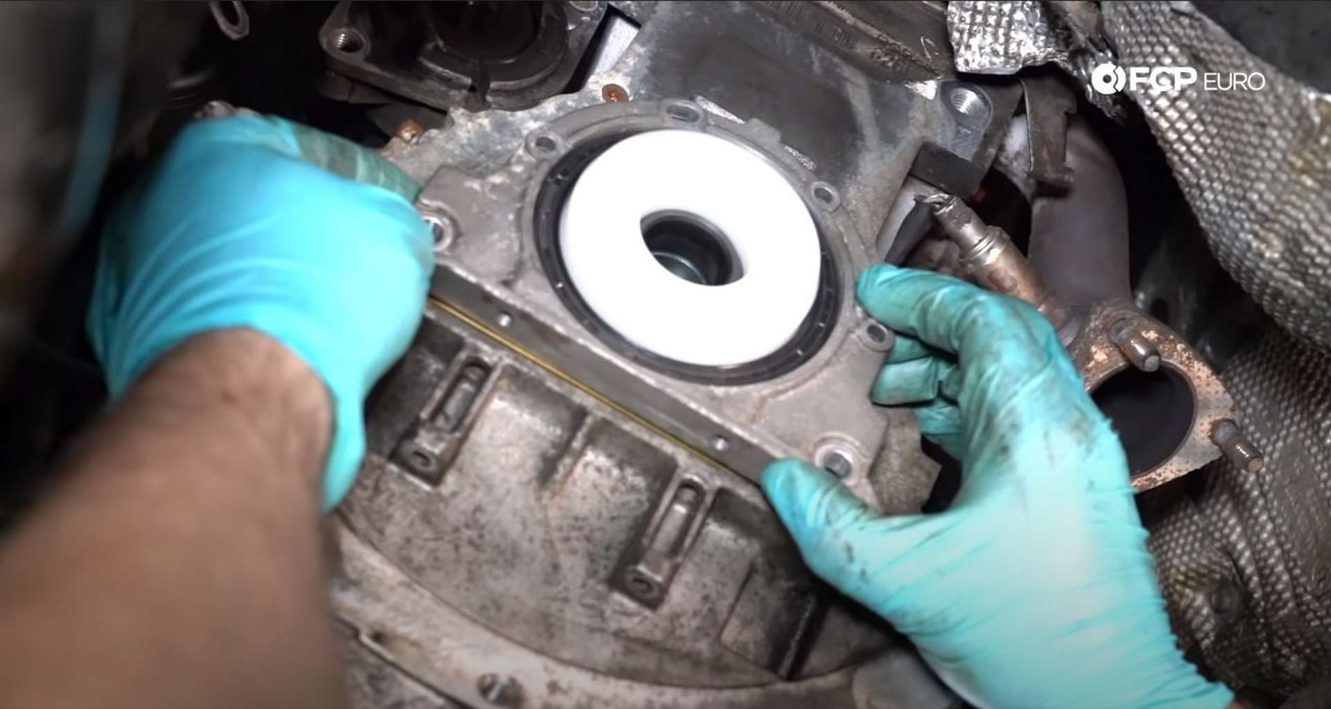 DIY BMW E46 Clutch Replacement installing the rear main seal assembly