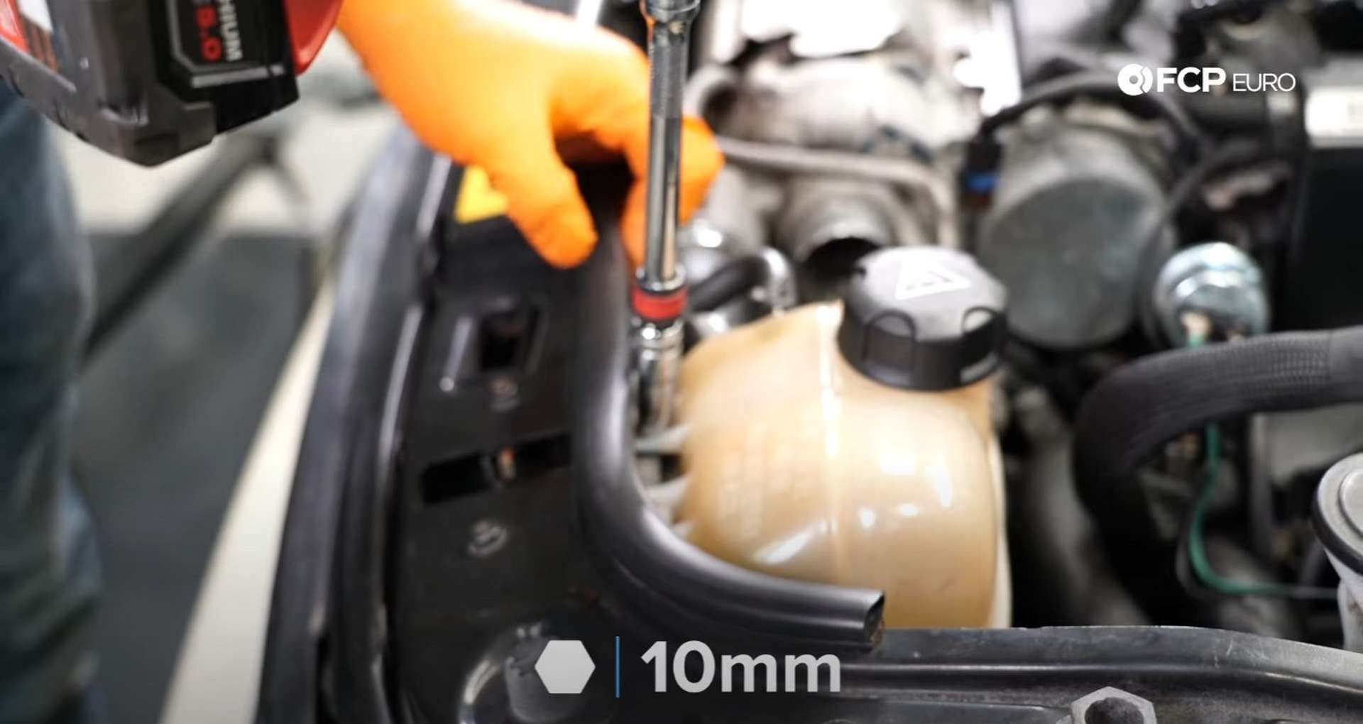 DIY MINI R56 Timing Chain Replacement disconnecting the coolant tank from the U-brace