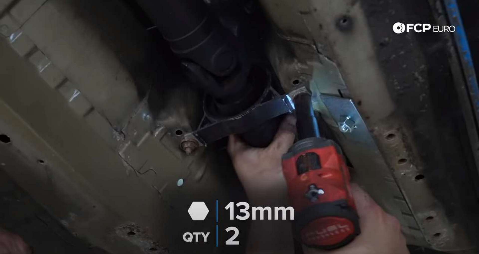 DIY BMW E46 Clutch Replacement removing the center driveshaft bolts