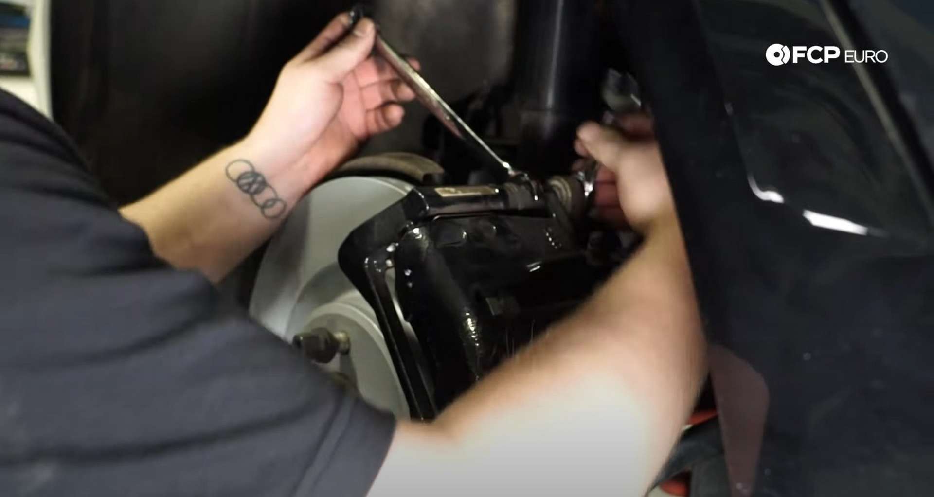 DIY Audi B8 S4 Rear Brake Service tightening the caliper mounting bolts]