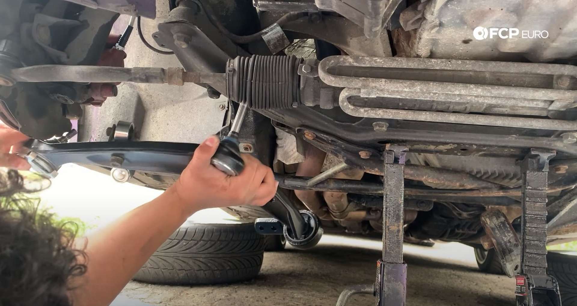 DIY BMW E36 Control Arm and Bushings installing the control arm into the subframe