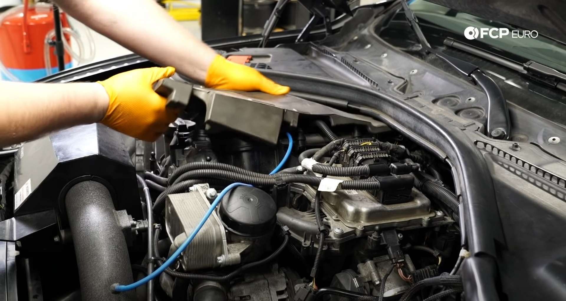 DIY BMW F30 Oil Filter Housing Gasket Replacement fitting the acoustic insulation to the valve cover