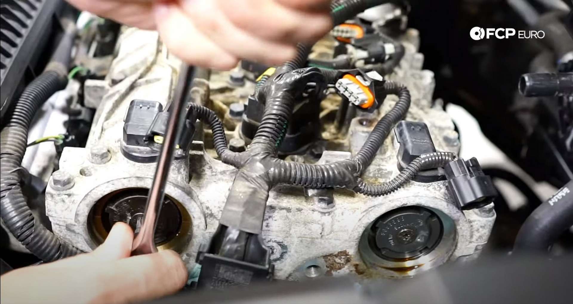 DIY Volvo P1 Timing Belt Replacement installing the cam position sensor wheels on the backs of the camshafts