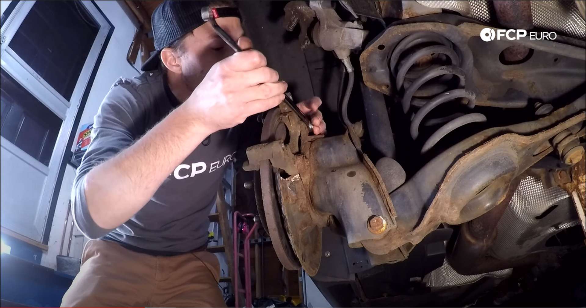 DIY Volvo Rear Brake Job loosening bracket bolts