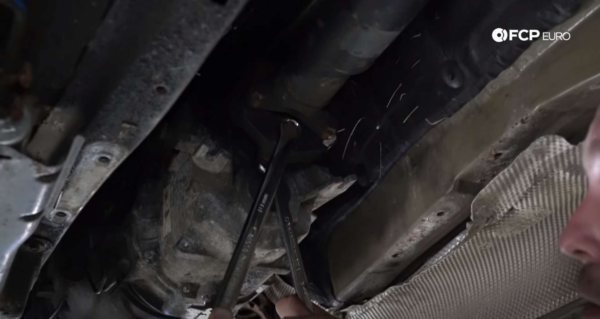 DIY BMW E46 Clutch Replacement removing the driveshaft bolts