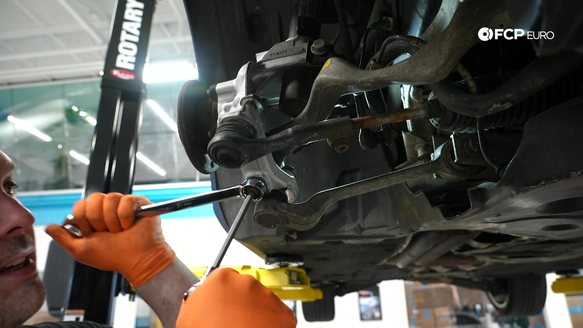 DIY BMW E90 Steering Knuckle Replacement tightening the control arm nuts