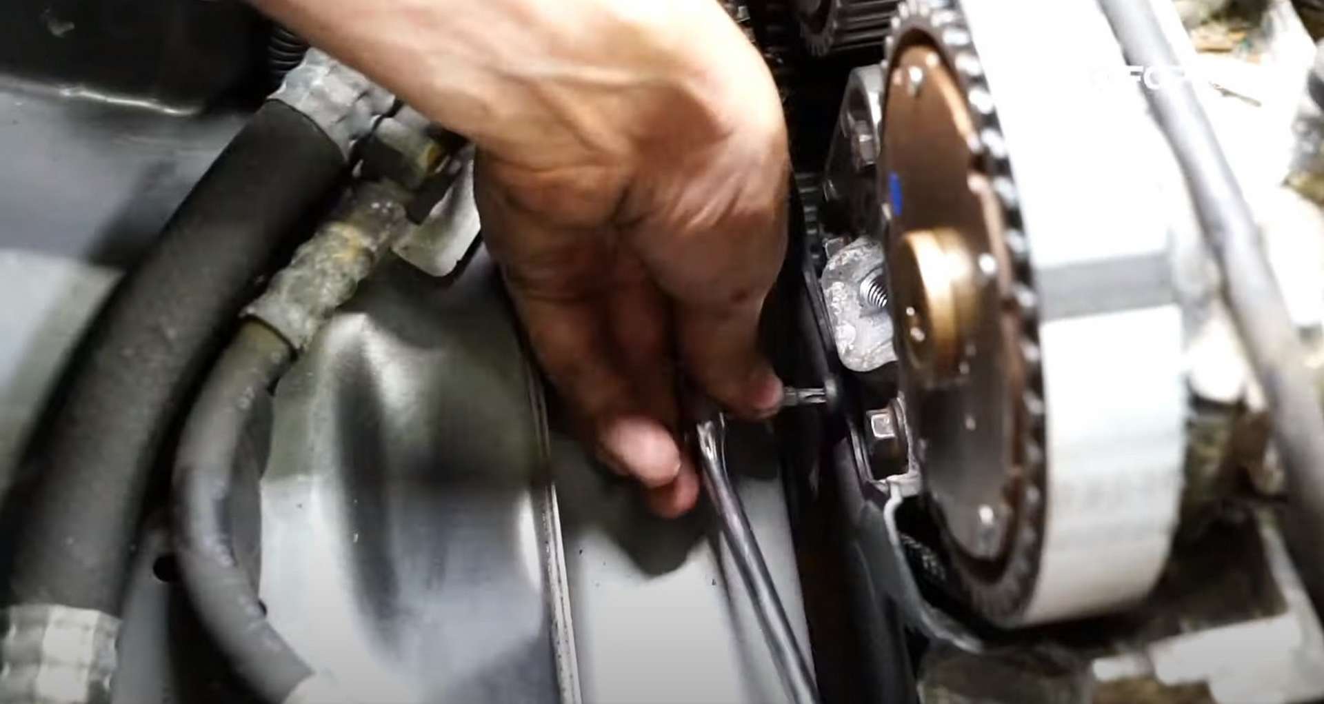 DIY Volvo P1 Timing Belt Replacement installing the lower outer timing cover