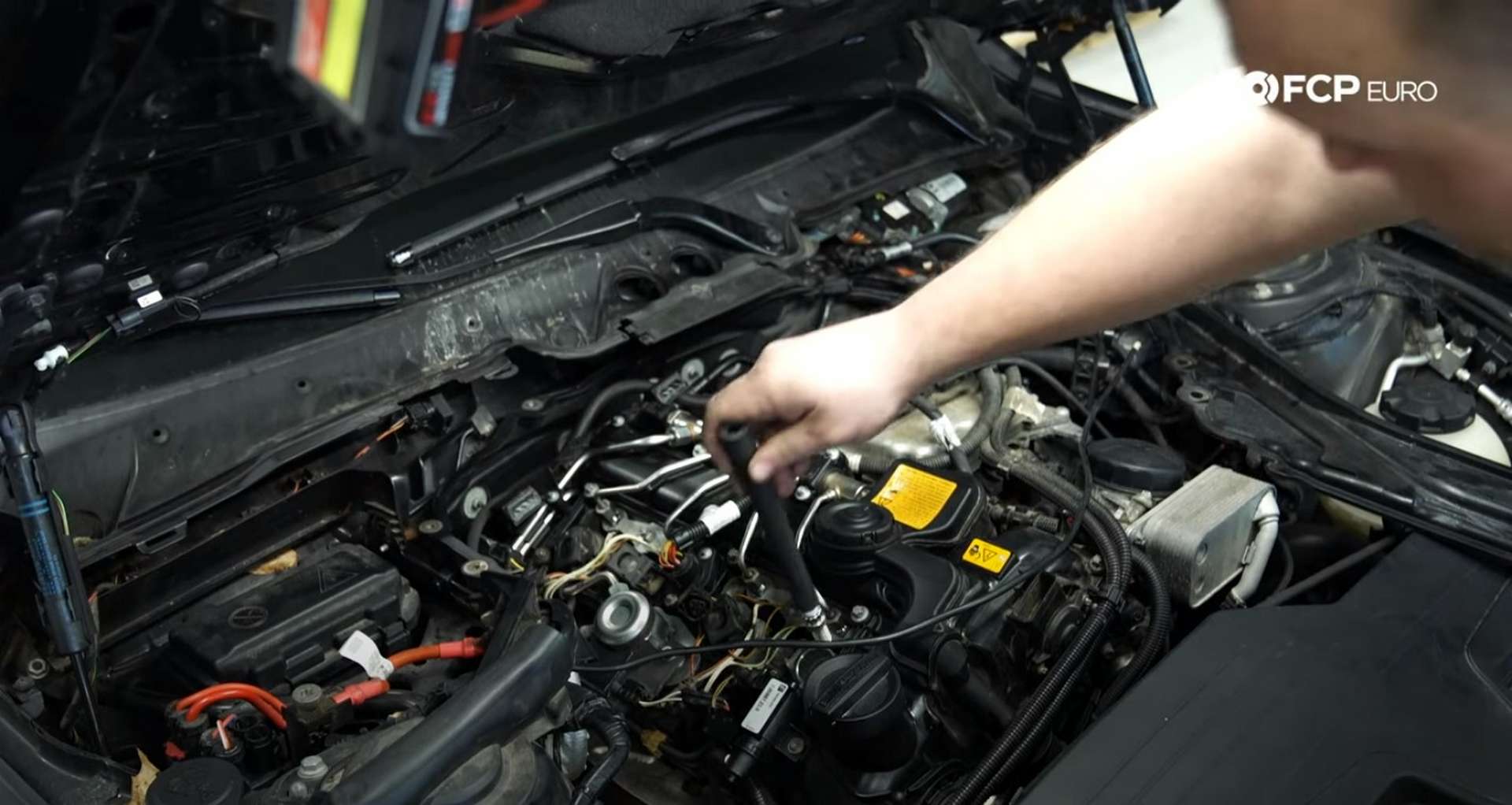 DIY BMW F30 Ignition Service threading in the new spark plugs with the rubber installation tool
