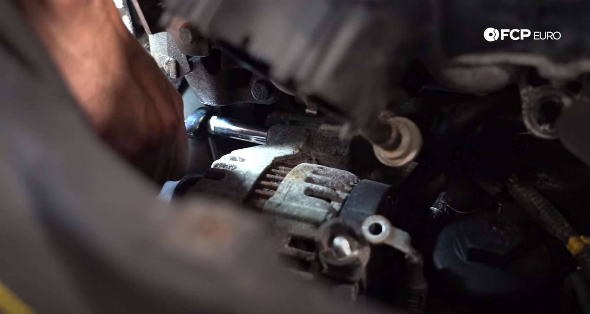 DIY Volvo Alternator and Serpentine Belt Replacement removing the alternator mounting bolts