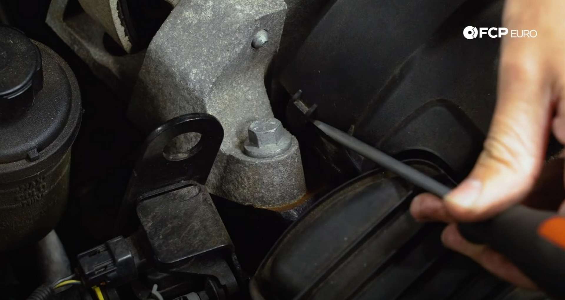 DIY Volvo Spark Plug and Ignition Coil Replacement unclipping the side of the timing cover