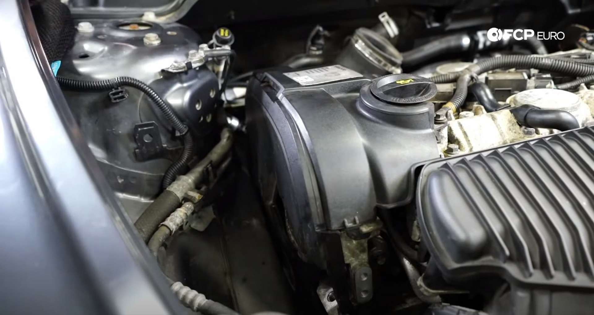 DIY Volvo P1 Timing Belt Replacement installing the upper timing cover pieces