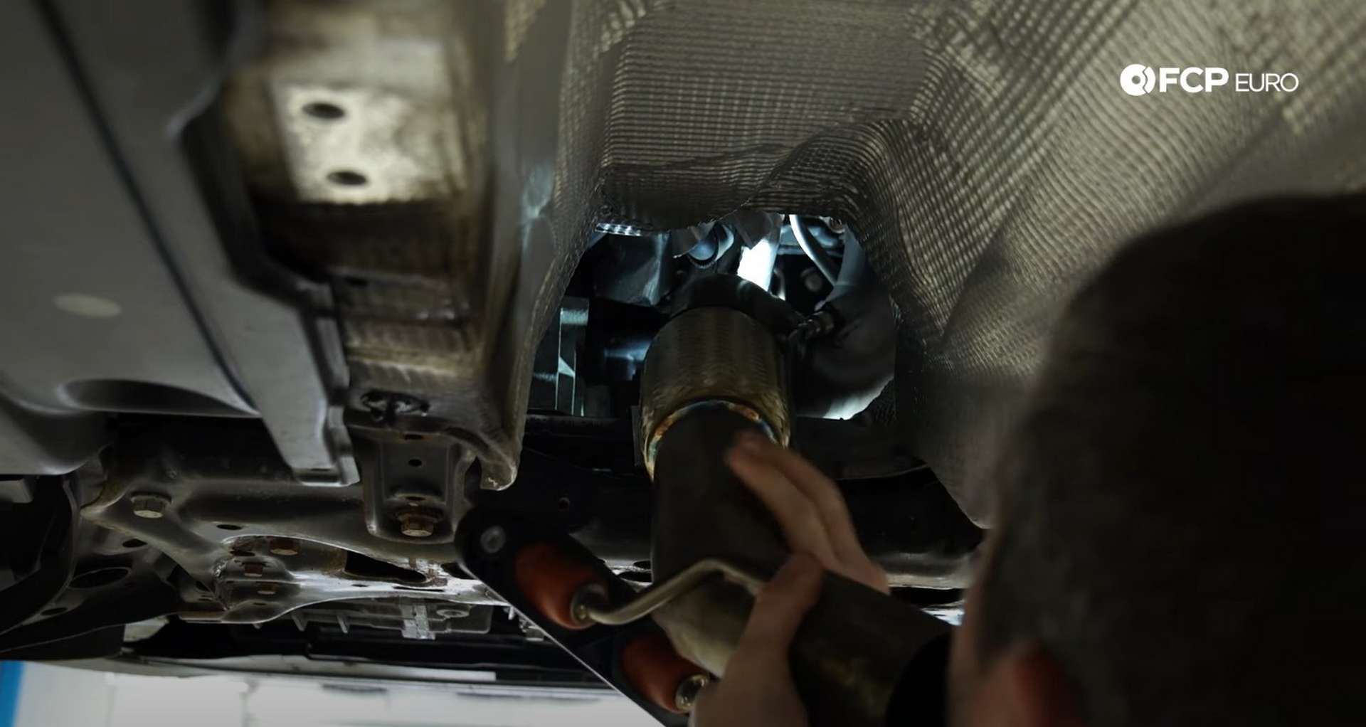 DIY MK7 VW GTI Turbocharger Upgrade fitting the downpipe into the engine bay