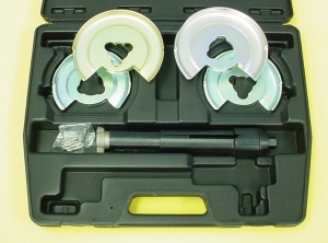 A klann-type internal coil spring compressor.