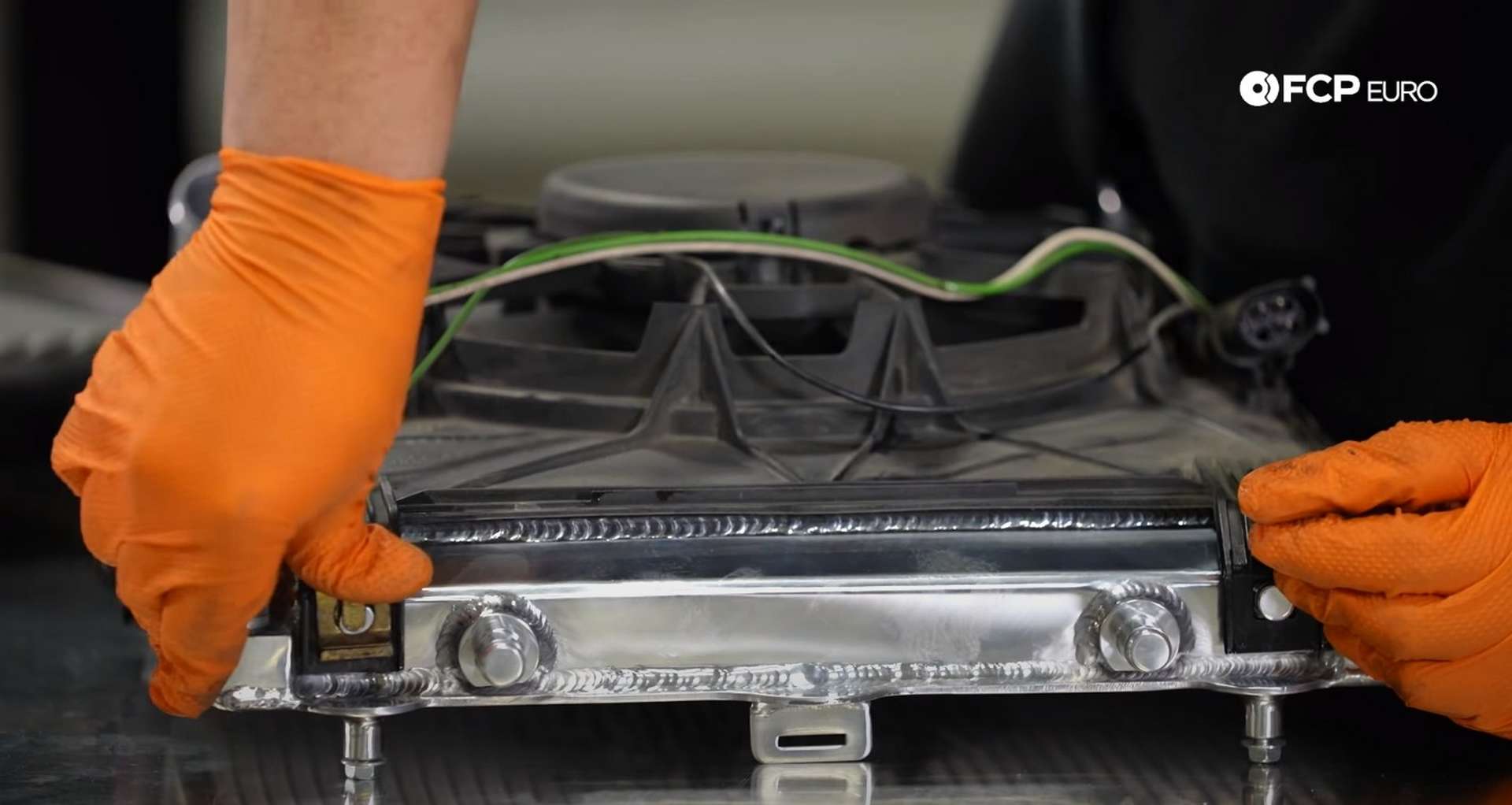 DIY Porsche 996 Radiator Replacement installing the assembly's retaining clips