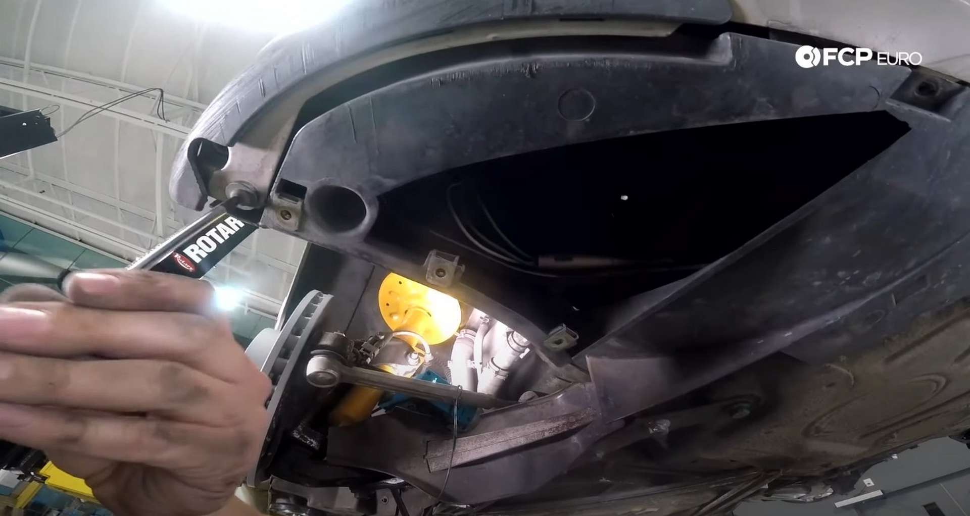 [DIY Porsche 996 Radiator Replacement installing fender liner fastener