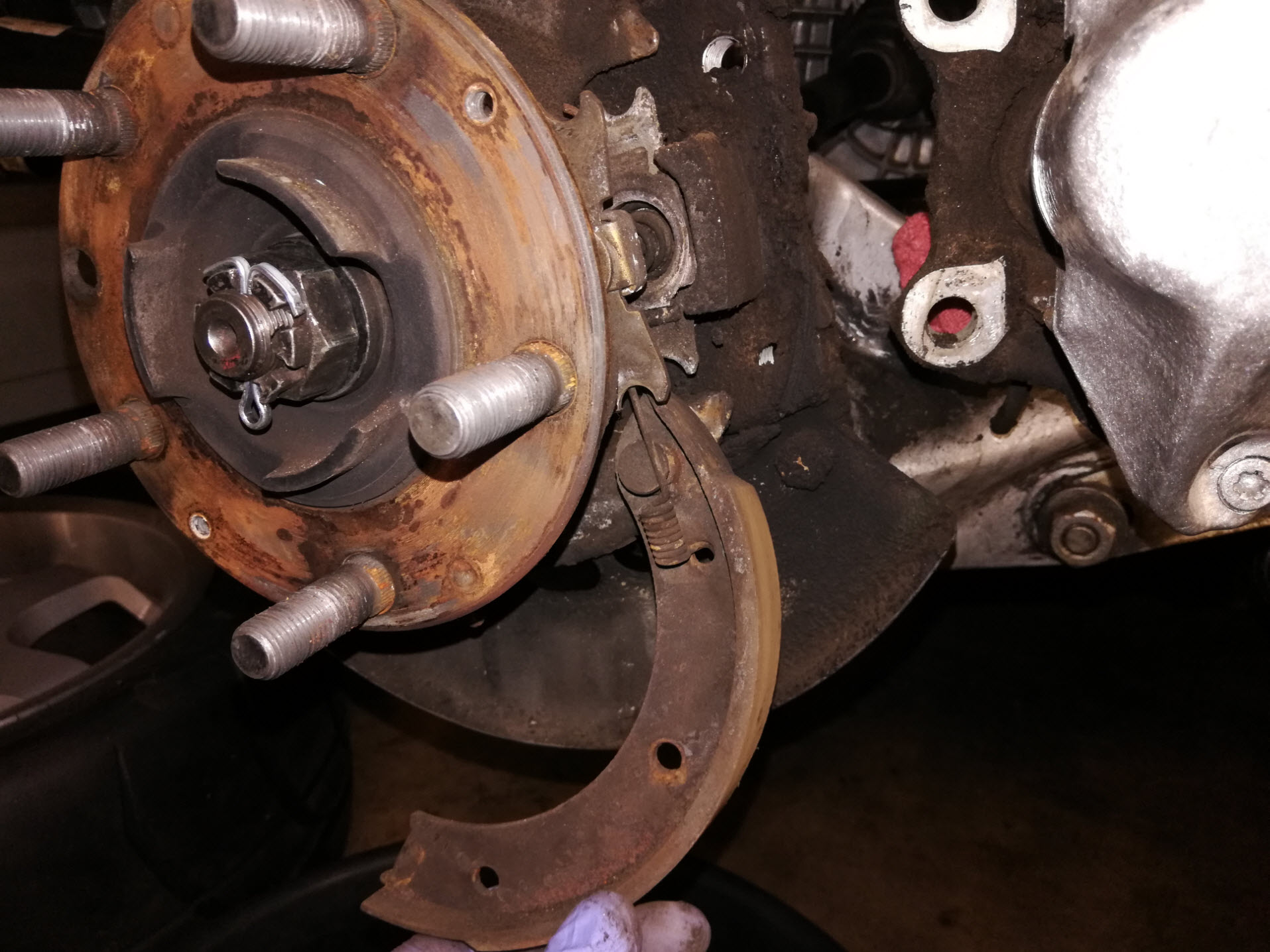 Air-cooled Porsche 911 parking brake shoe removal.