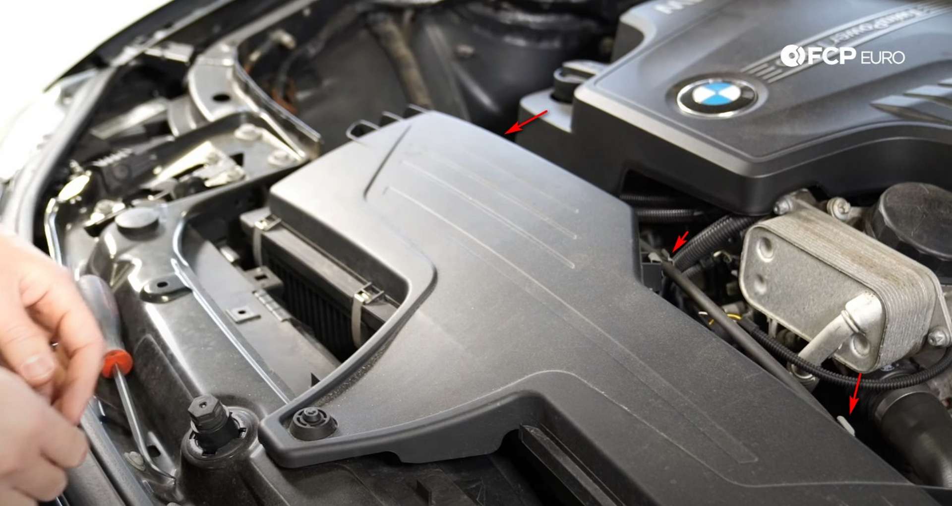 DIY BMW F30 Air Filter Replacement disconnecting the hood cable