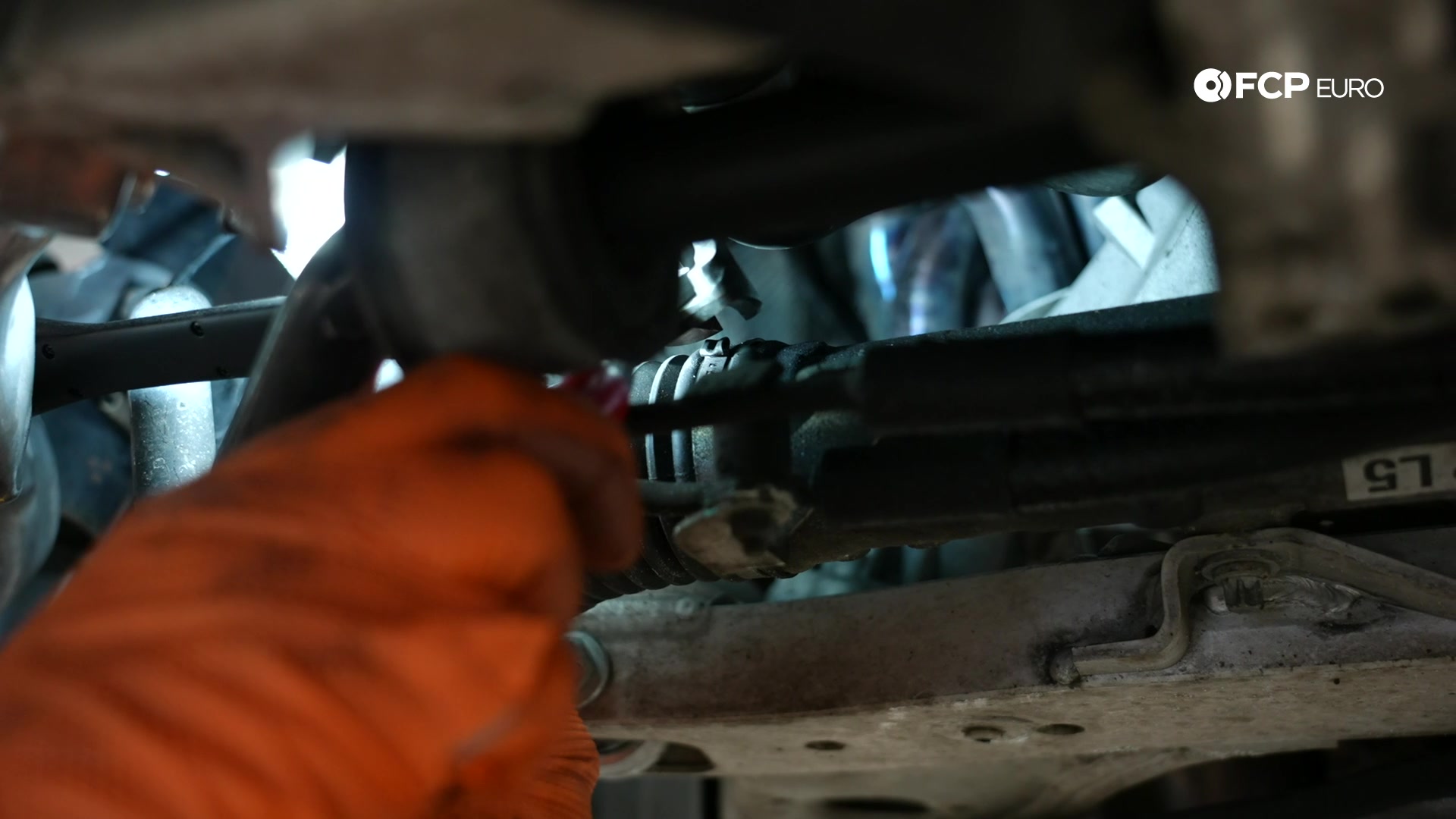 DIY BMW E90 Tie Rod Replacement removing the inner rack boot clamp with cutters