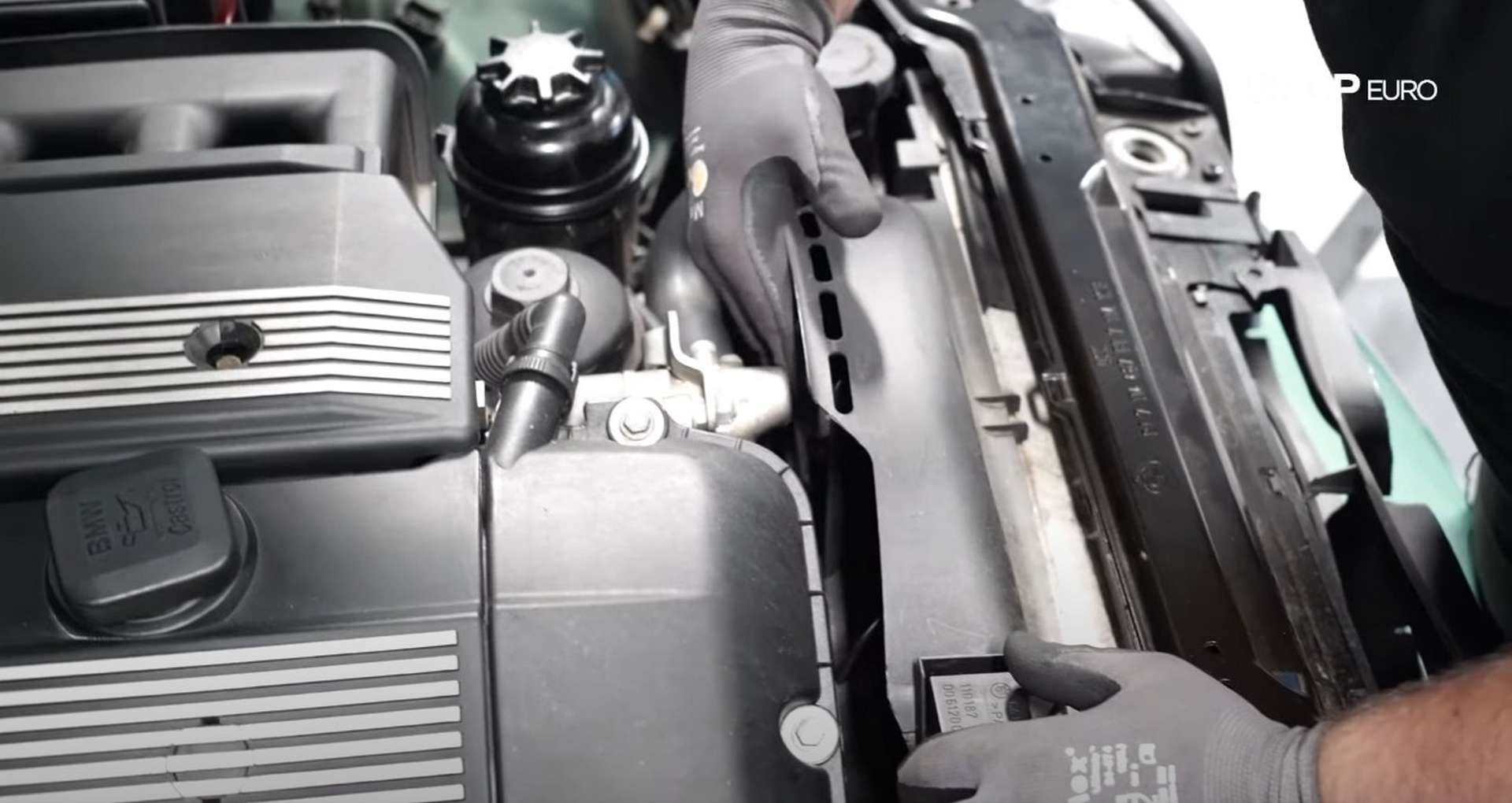 DIY BMW E46 Oil Filter Housing Gasket and VANOS Line Replacement removing the fan
