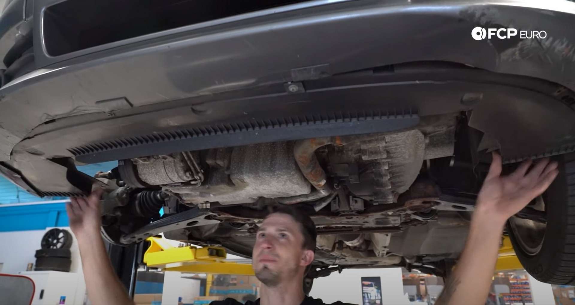 DIY Volvo Alternator and Serpentine Belt Replacement installing the lower air spoiler