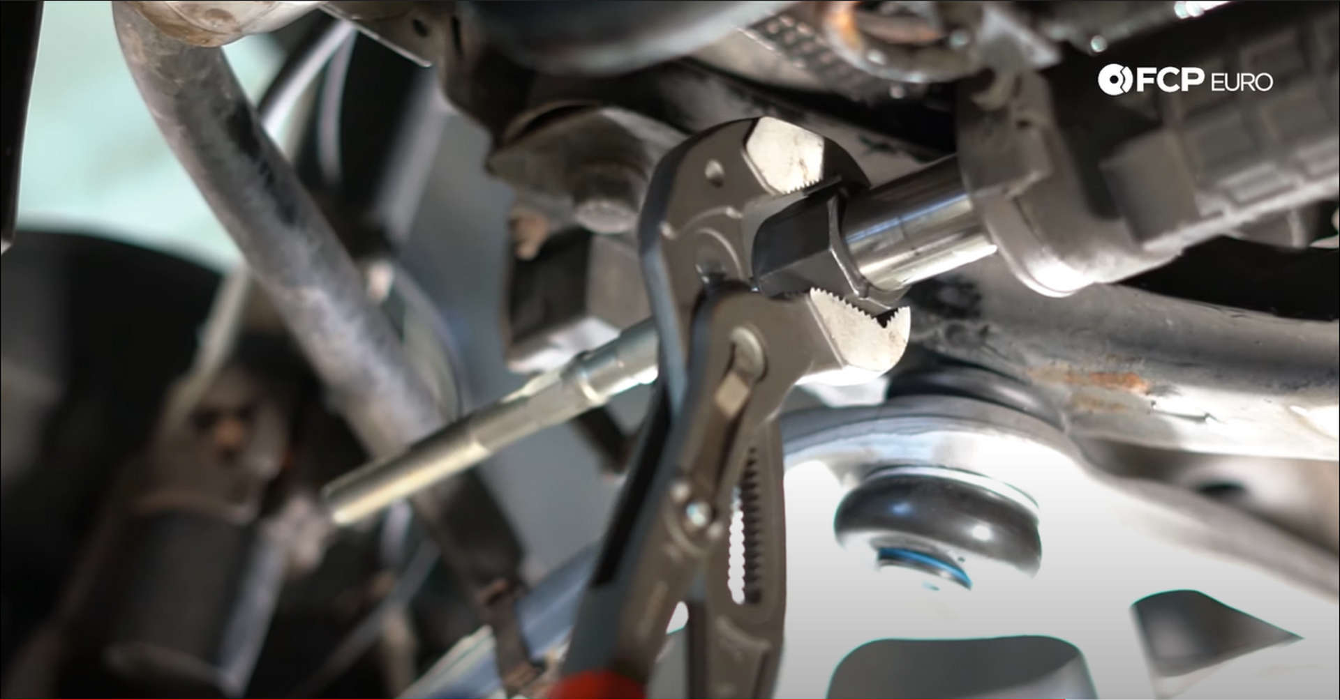 DIY BMW Front Suspension Refresh tightening the inner tie rod