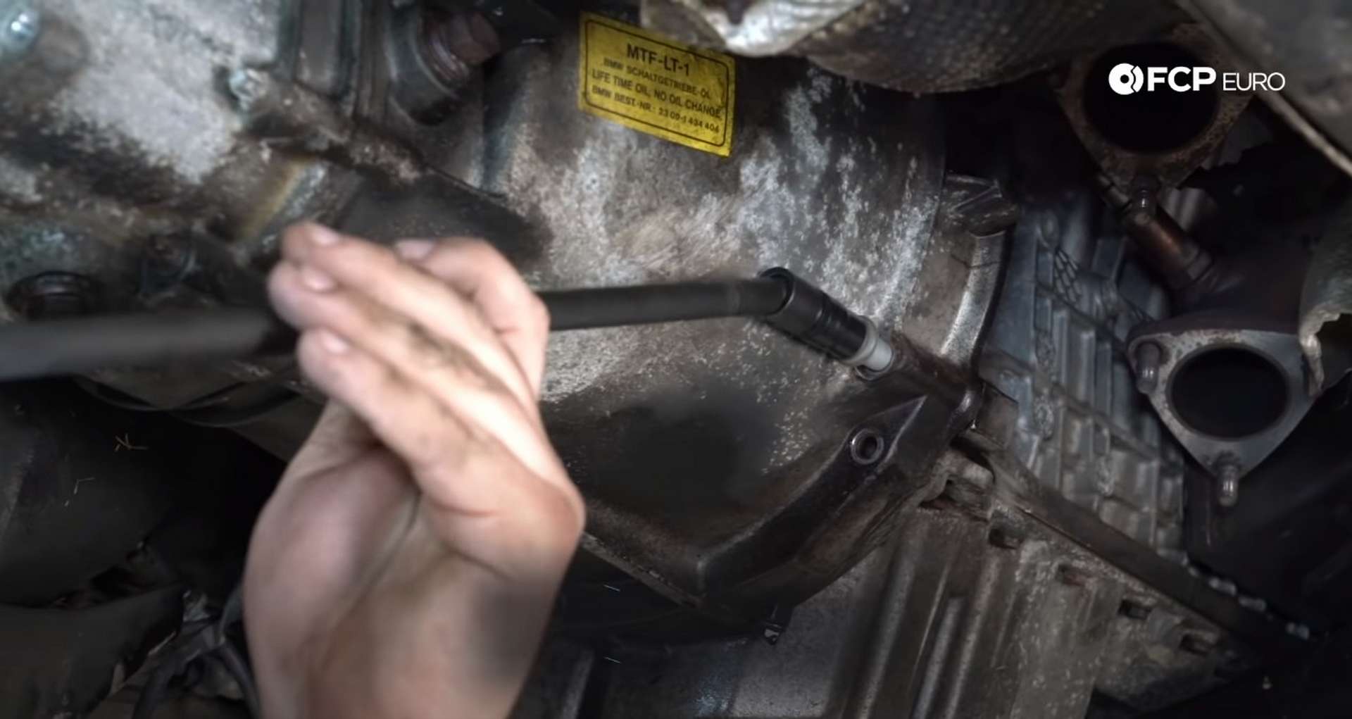 DIY BMW E46 Clutch Replacement removing the bell housing bolts